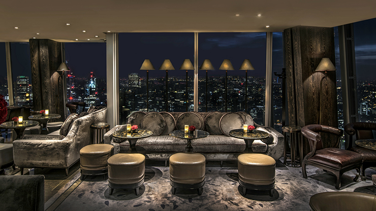 Bottle of champagne and table with a view
